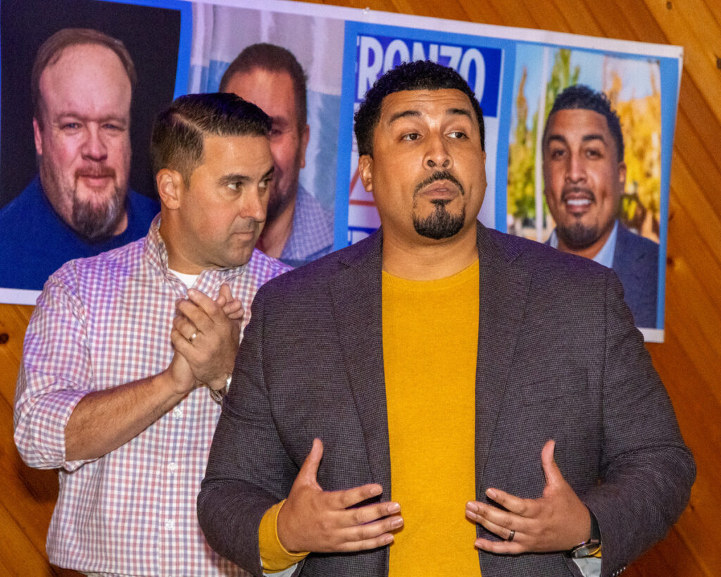 Dr. Frank Gerratana photo. Rep. Manny Sanchez (D-24) speaks while state representative candidate David DeFronzo listens.