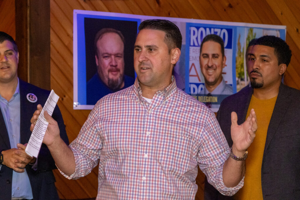 Dr. Frank Gerratana photo. 26th District state representative candidate David DeFronzo speaks while Rep. Gary Turco (D-27) and Rep. Manny Sanchez (D-24) listen.